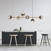 Modern Glass Ball Pendant Light illuminating minimalist kitchen with sleek design and elegant glass orbs.