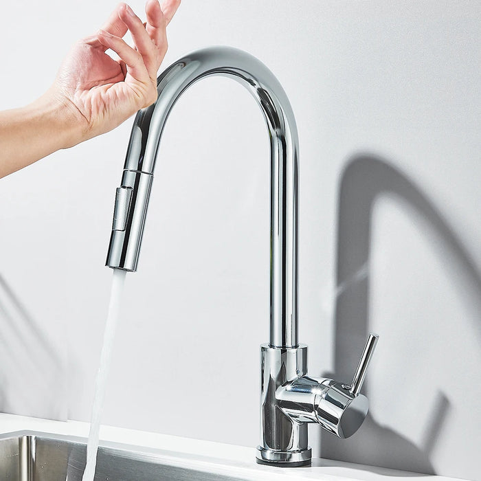 Touch sensor kitchen faucet with sleek chrome design in use for hands-free operation.