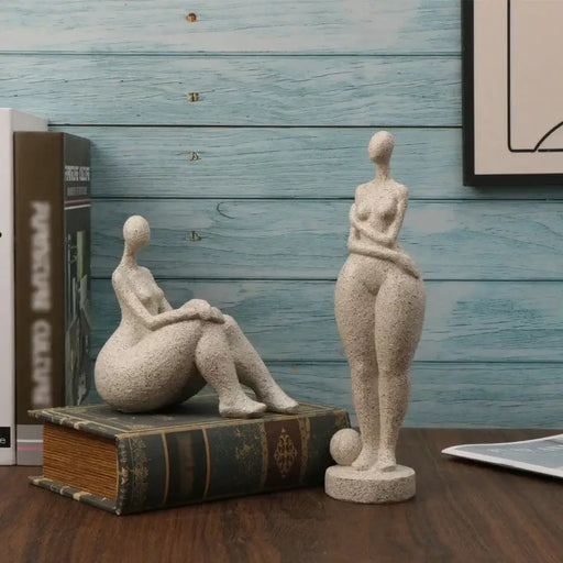 Sandstone chubby woman sculpture on table, featuring abstract female forms with smooth texture, ideal for modern home decor.