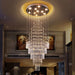 Grand Spiral Crystal Chandelier illuminating a luxurious interior with cascading crystals and modern design in a high-ceiling room.