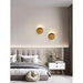 Modern bedroom with artistic wall lamps, sleek aluminum design, and LED lighting for contemporary interiors.