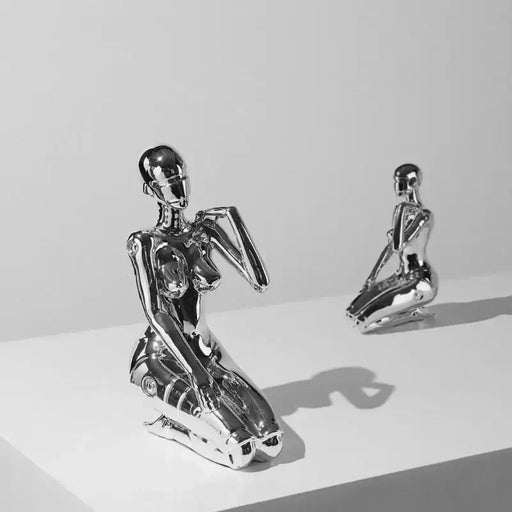 Modern Mechanical Goddess sculpture in silver resin finish on display, showcasing futuristic design and elegance.