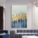 Abstract oil painting "The Blue Ocean" in a modern living room, featuring vibrant blue and gold hues on premium linen canvas.