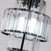 Close-up of tiered crystal glass pendant light with multi-layered design, featuring elegant LED illumination.