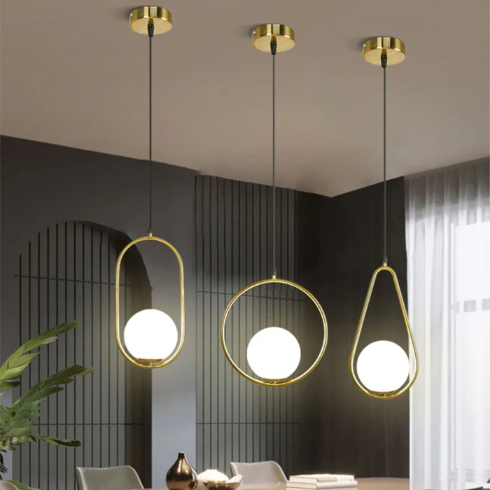 Modern Nordic pendant lamps with metal and glass shades in gold finish, ideal for parlors, studies, or master bedrooms.