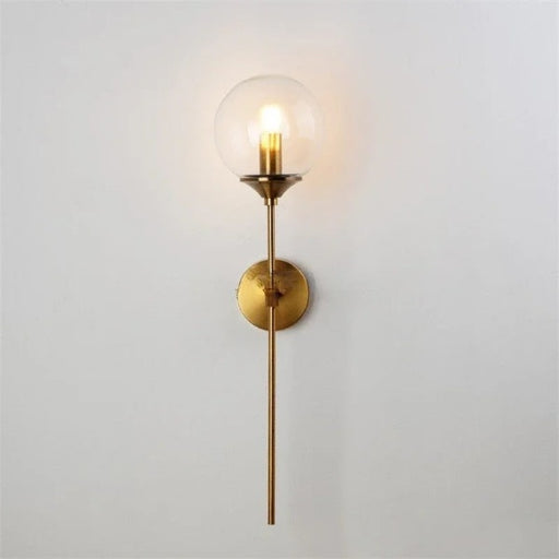 Modern long arm glass wall lamp with elegant gold finish and glass ball shade, perfect for bedroom or living room lighting.