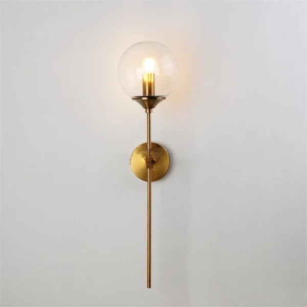 Modern long arm glass wall lamp with elegant gold finish and glass ball shade, perfect for bedroom or living room lighting.