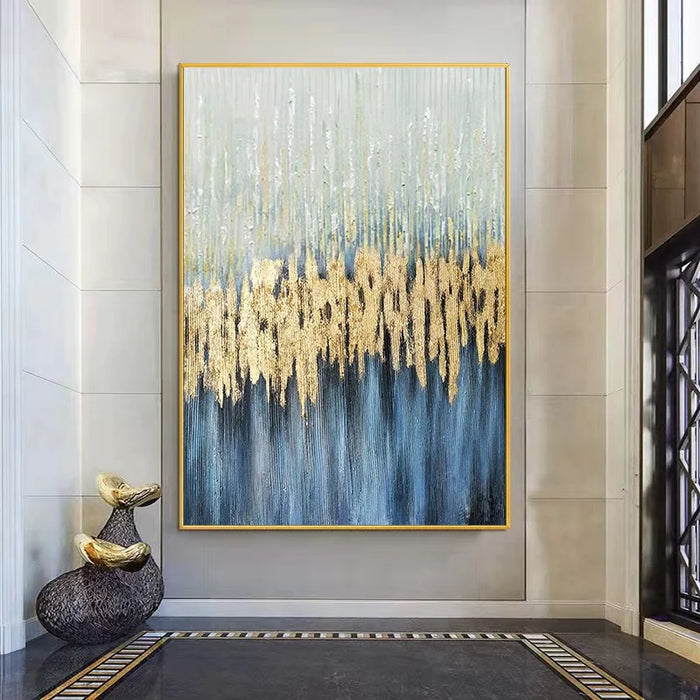 Abstract blue and gold oil painting on premium linen canvas in modern interior setting.