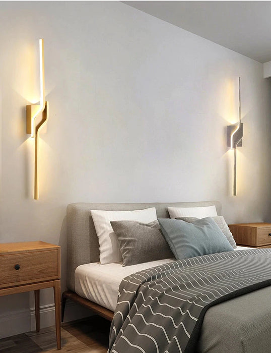 Modern minimalist LED wall sconces in bedroom, illuminating with soft light. Contemporary design in a stylish setting.