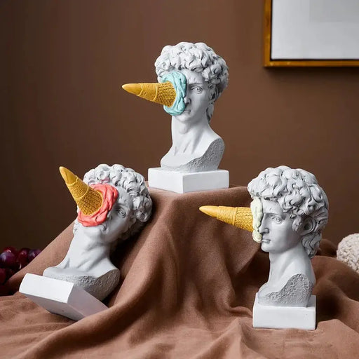 Ice Cream David Bust Sculptures with colorful cones on face, playful decor blending classical art and humor, set of three on display.