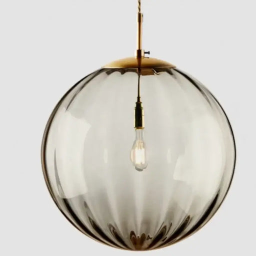 Smoky gray glass ball pendant light with LED bulb and modern design.