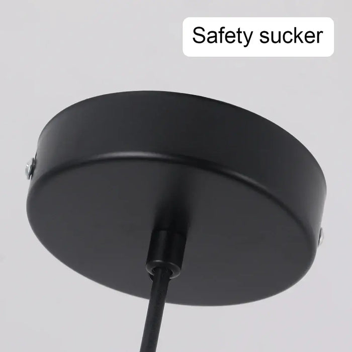 Black ceiling mount for tiered crystal glass pendant light, showcasing safety sucker attachment.