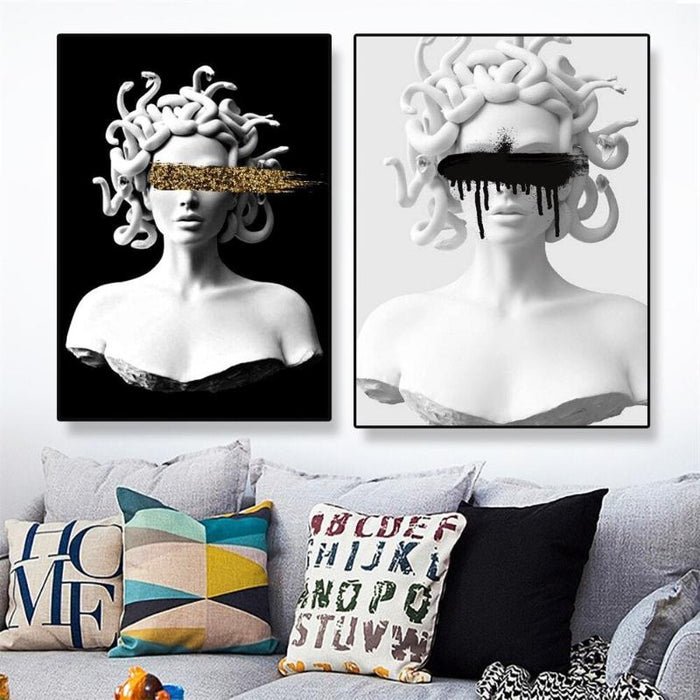 Contemporary Medusa canvas art prints in black and white hanging above a modern sofa with colorful cushions.