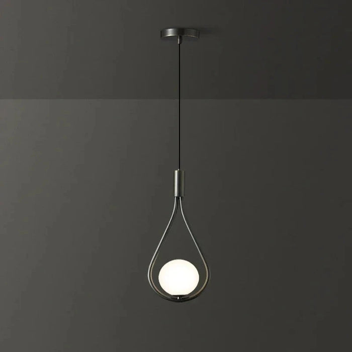 Modern frosted glass globe chandelier with LED bulb hanging in dark room, ideal for bedrooms and living rooms.