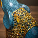 Blue retro resin elephant decor with intricate golden details, showcasing elegant craftsmanship and nostalgia.