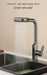 Hydroelectric kitchen faucet with LED temperature display showing water flowing from smart rain water mode in a modern sink.