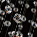 Close-up of dazzling crystals from a Grand Spiral Crystal Chandelier, showcasing luxurious design elements against a dark background.