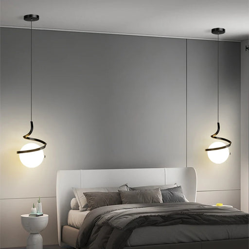 Modern bedroom with Norse LED pendant lamps illuminating a stylish interior design.