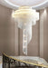 Modern Loft Spiral Chandelier with golden tassel design, hanging in elegant interior setting.