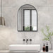 Large arch mirror with modern aluminum frame above sink in stylish bathroom.