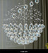 Ultra-modern spiral crystal chandelier with premium clear crystals in a luxurious design, turned off.