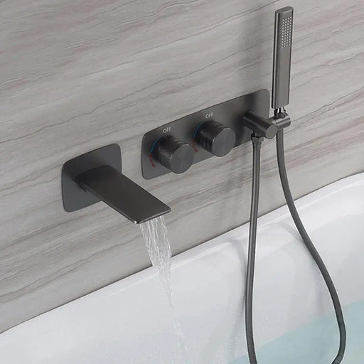 Gunmetal dual-handle waterfall bath faucet with handshower holder and modern design in a contemporary bathroom setting.