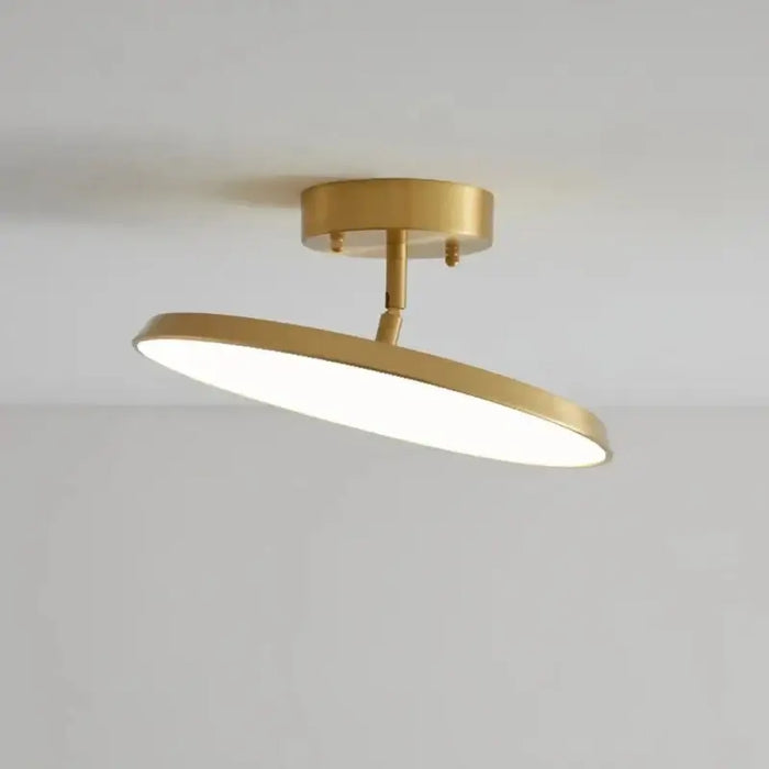 Modern rotatable LED ceiling light with minimalist design and gold finish, ideal for elegant home interiors.