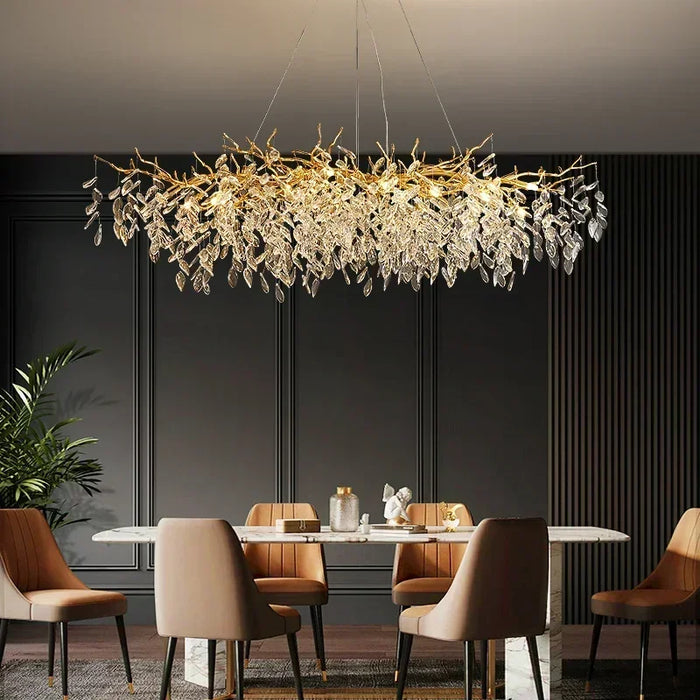 Luxurious crystal chandelier hanging over an elegant dining table with upholstered chairs, enhancing the room's sophisticated ambiance.