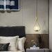 Modern single-light frosted glass globe chandelier in bedroom with elegant decor