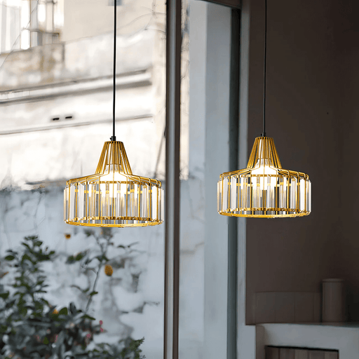 Modern caged glass pendant lights in stainless steel frame, ideal for dining room or kitchen elegance.