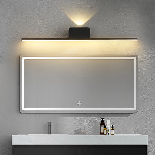 Modern long strip wall lamp with LED lighting above bathroom mirror in stylish, minimalistic setting.