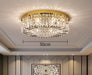 Luxury modern crystal round ceiling chandelier in an elegant room, gold finish, 50cm diameter, luminous and sophisticated design.