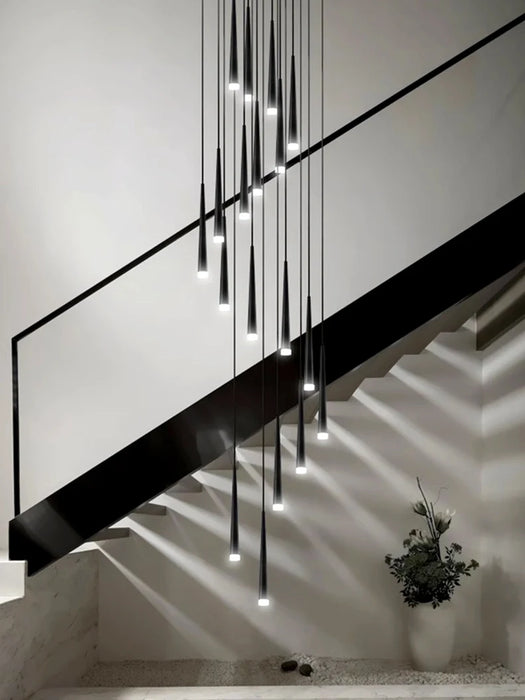 Modern chandelier with sleek hanging lights illuminating a staircase, featuring a stylish cord pendant design and durable alloy material.