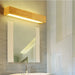 Elegant wood LED wall lamp above bathroom mirror, modern design with adjustable up & down lighting, CE and ROHS certified.