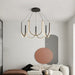 Modern Light Luxury Chandelier with black finish and LED illumination in a stylish contemporary room.