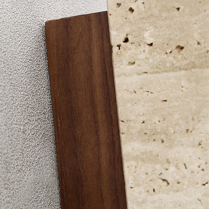 Close-up of geometric travertine wall light with natural stone and brown wood materials.