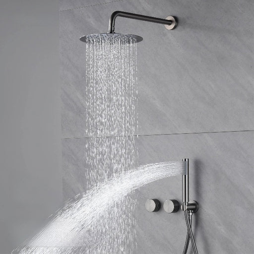 Luxury brass concealed shower system with dual handle control and polished finish in use, showcasing rainfall and handheld showerhead.