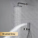 Brushed grey concealed shower system with dual handle control and rainfall showerhead.