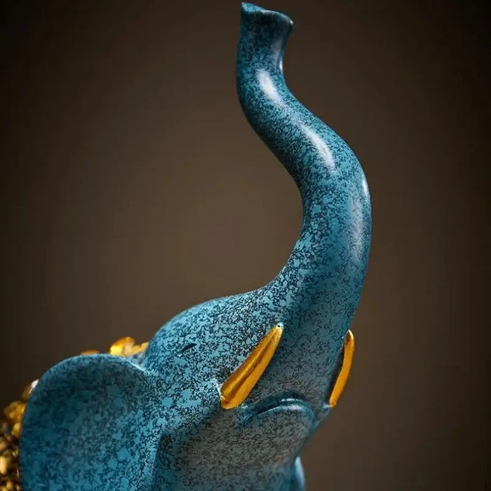 Blue retro resin elephant decor with intricate golden details, showcasing its elegant trunk and textured surface.