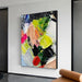 Textured knife abstract oil painting with vibrant colors on canvas displayed in modern home setting.