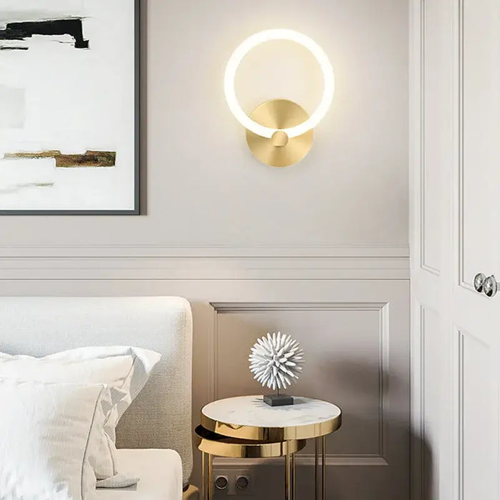 Modern Nordic LED ring wall lamp in elegant bedroom decor with minimalist design, perfect for contemporary interiors.