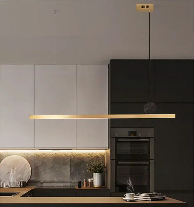 Linear LED bar pendant lamp illuminating a modern kitchen with minimalist design and energy-efficient lighting.