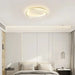 Modern LED ceiling flush mount lamp illuminating a stylish bedroom with elegant design and sleek minimalist appearance