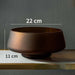 Elegant matte brown bowl with 22 cm diameter and 11 cm height on display shelf.