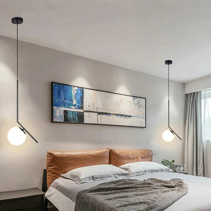 Modern Nordic pendant lamps in bedroom with metal and glass design, ideal for master bedroom lighting, LED bulbs, elegant decor.