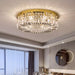 Luxury modern crystal round ceiling chandelier illuminating a stylish living room with elegance and sophistication.