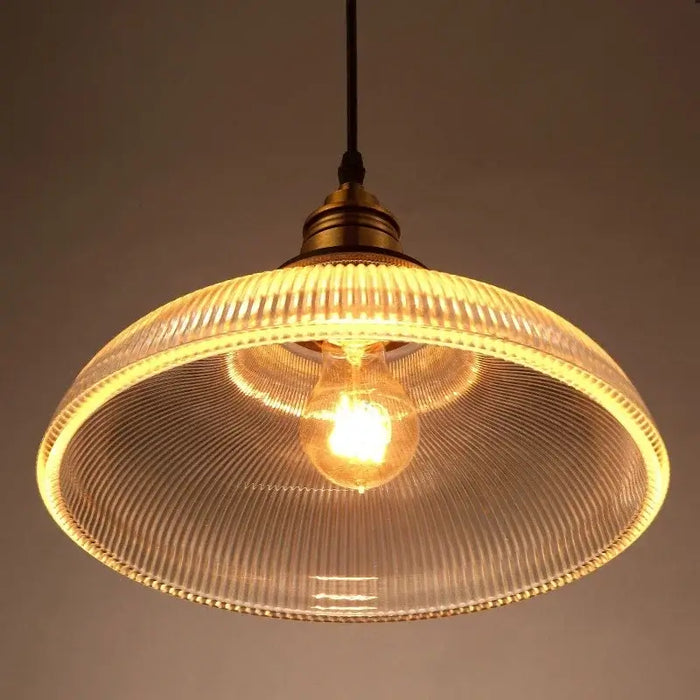 Vintage glass stripe pendant light with glowing bulb, retro ceiling light, textured shade, ambient warm glow for dining areas.