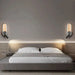 Modern bedroom with rotatable LED headboard lights and stylish bed setup