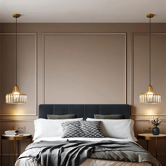 Modern caged glass pendant lights illuminating a stylish bedroom with a plush bed and elegant decor.