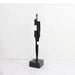 Modern black cast iron sculpture on a white background, featuring an abstract design for contemporary decor.